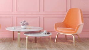 A pink panelled wall adds a touch of elegance, and the light wood flooring keeps everything feeling airy.